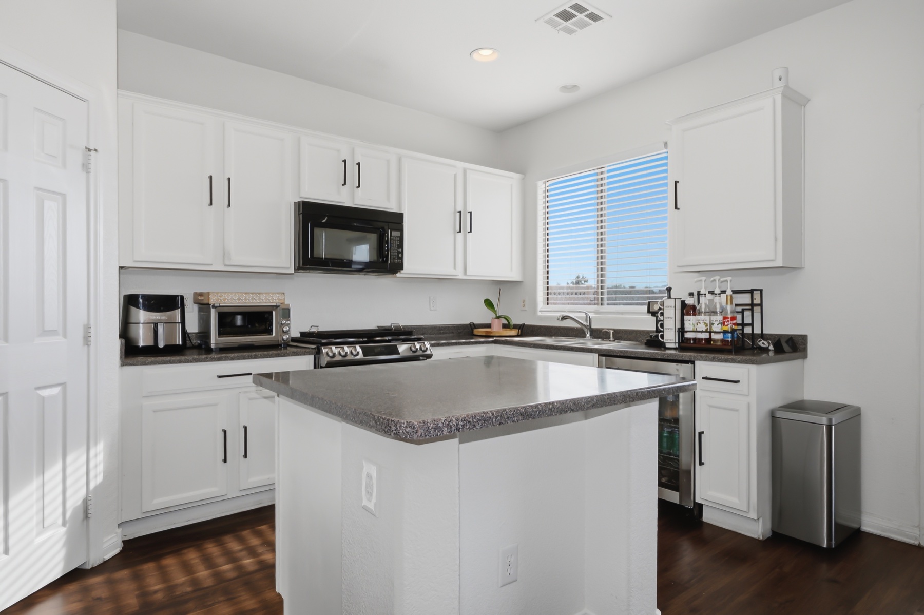 Bright white kitchen with island