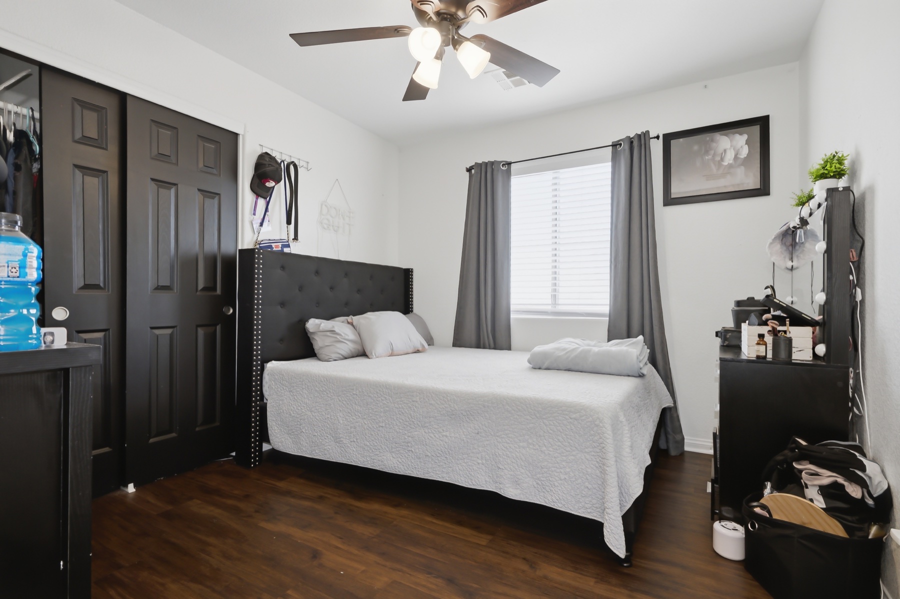 Upstairs bedroom with wood-look flooring